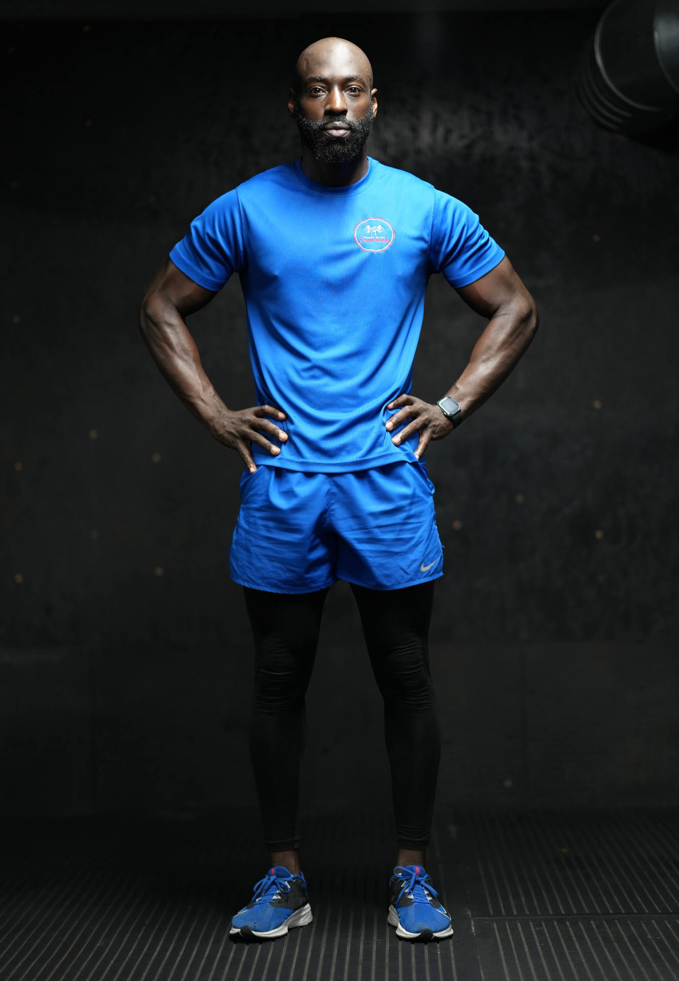 Charles standing in blue training kit