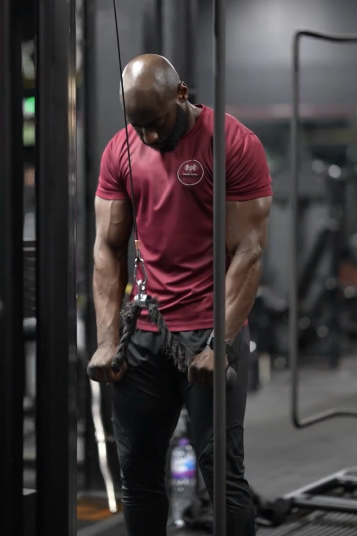 Charles training in a gritty industrial gym